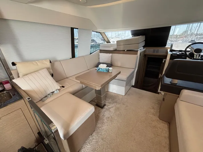  Yacht Photos Pics Luxurious interior of 2020 Jeanneau Prestige 420 Flybridge yacht with plush seating and elegant decor.