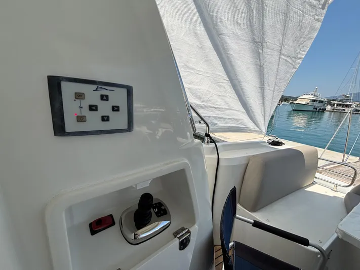  Yacht Photos Pics Flybridge control panel on 2020 Jeanneau Prestige 420 yacht, docked with scenic marina view.