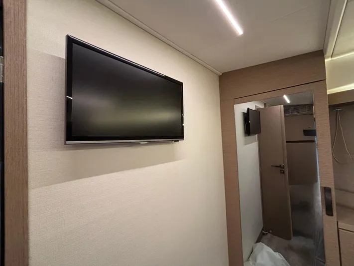  Yacht Photos Pics Interior of 2020 Jeanneau Prestige 420 Flybridge with wall-mounted TV and modern design.