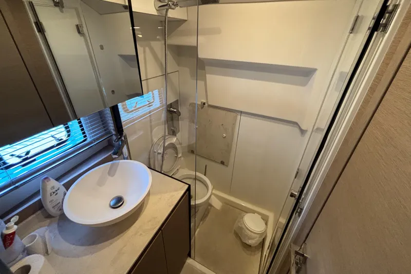  Yacht Photos Pics Modern bathroom in 2020 Jeanneau Prestige 420 Flybridge yacht, featuring sink, toilet, and shower.
