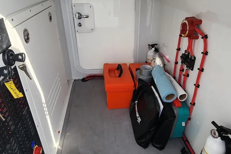 Arrogant 1 Yacht Photos Pics Interior of a 2022 Freeman 37 Center Console with storage and safety equipment.