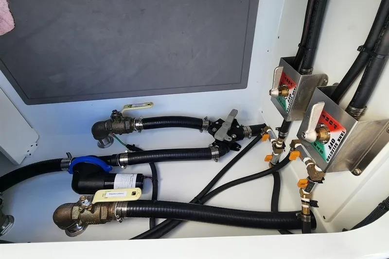 Arrogant 1 Yacht Photos Pics 2022 Freeman 37 Center Console boat plumbing system with valves and hoses.