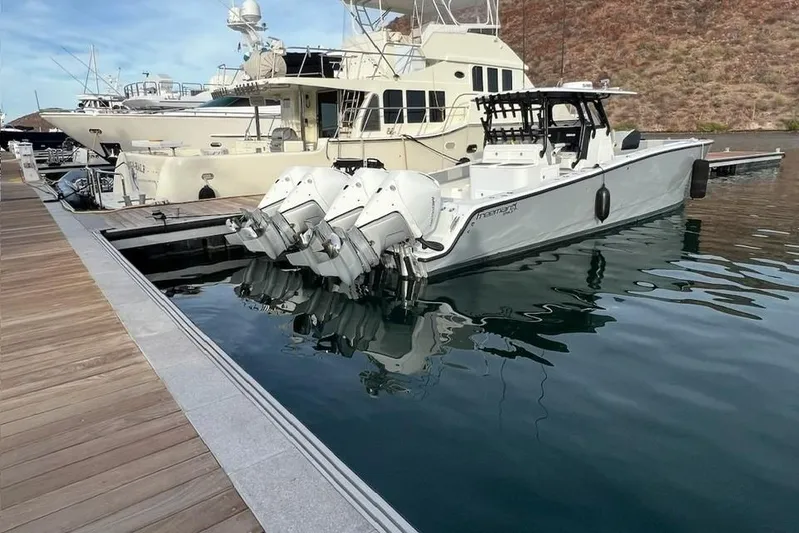 Arrogant 1 Yacht Photos Pics 2022 Freeman 37 Center Console boat docked with multiple outboard engines.