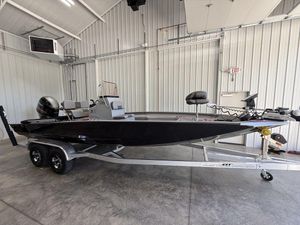 2024 Xpress H22B boat on trailer in a garage setting.