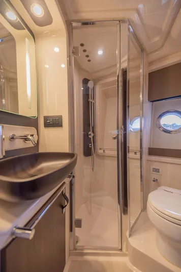  Yacht Photos Pics Luxurious bathroom in 2018 Azimut 50 Flybridge yacht with modern fixtures and shower.