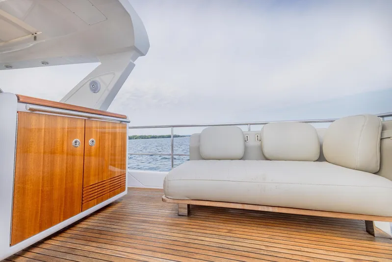  Yacht Photos Pics Luxurious Azimut 50 Flybridge 2018 yacht with elegant deck seating and wooden cabinetry.