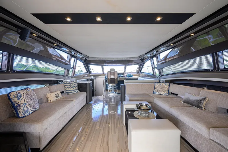 Andiamo Yacht Photos Pics Luxurious interior of 2016 Marquis 660 Sport Yacht with elegant seating and modern design.