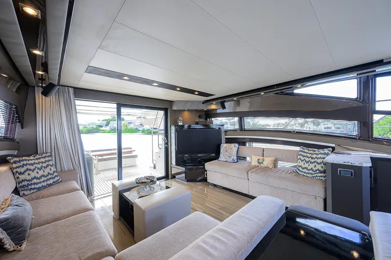 Andiamo Yacht Photos Pics Luxurious interior of 2016 Marquis 660 Sport Yacht with elegant seating and modern decor.