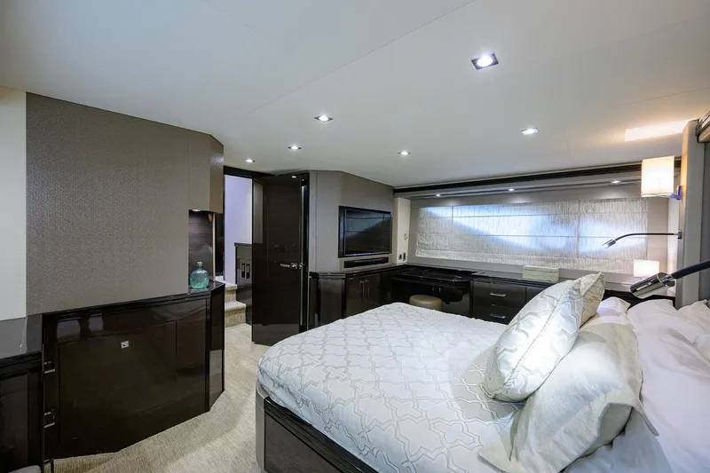 Andiamo Yacht Photos Pics Luxurious bedroom interior of 2016 Marquis 660 Sport Yacht with modern decor and ambient lighting.