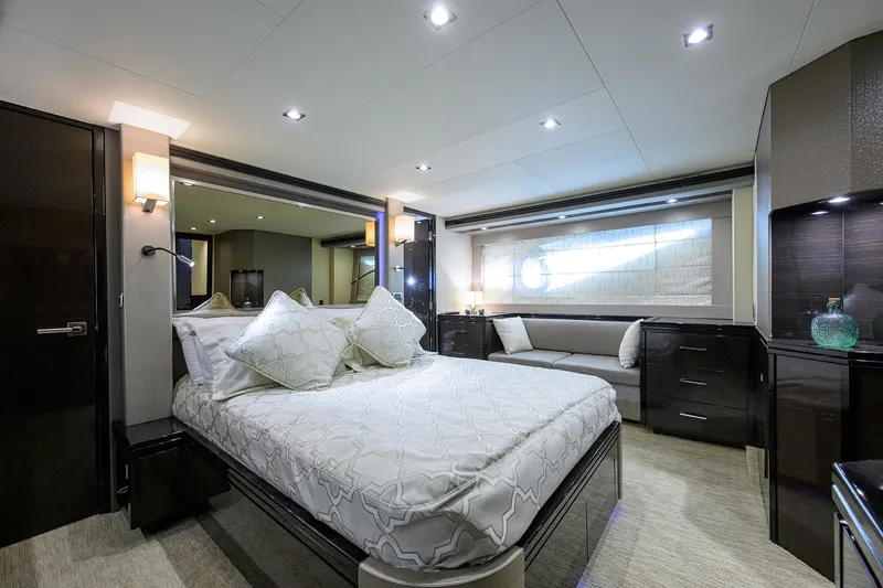 Andiamo Yacht Photos Pics Luxurious bedroom interior of 2016 Marquis 660 Sport Yacht with elegant bedding and modern decor.