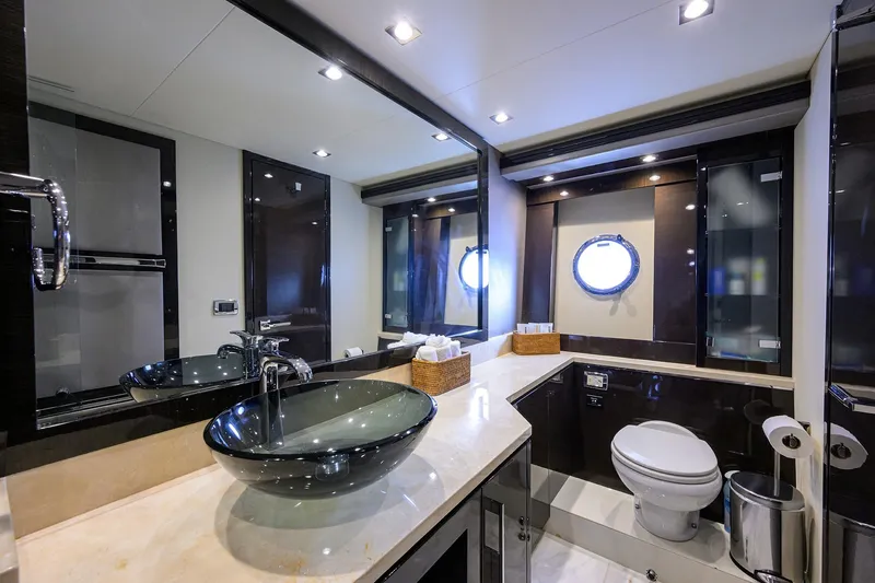 Andiamo Yacht Photos Pics Luxurious bathroom in 2016 Marquis 660 Sport Yacht with modern fixtures and elegant design.