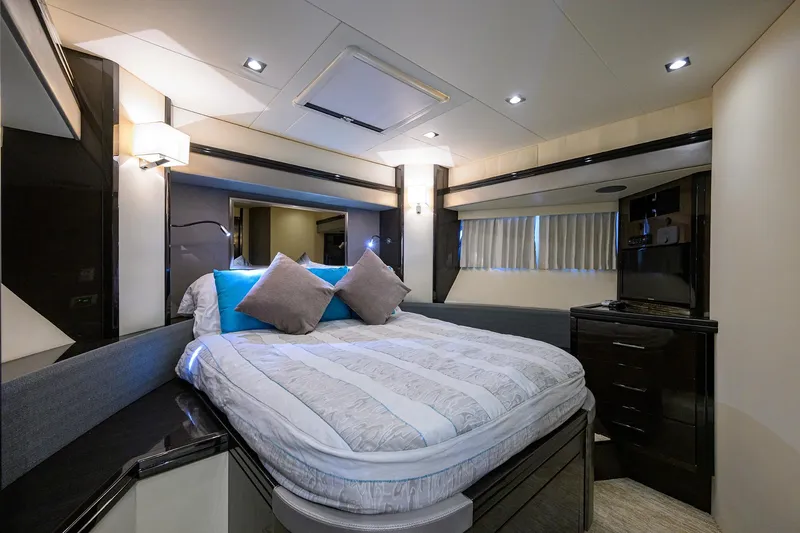 Andiamo Yacht Photos Pics Luxurious bedroom interior of 2016 Marquis 660 Sport Yacht with modern design and cozy bedding.