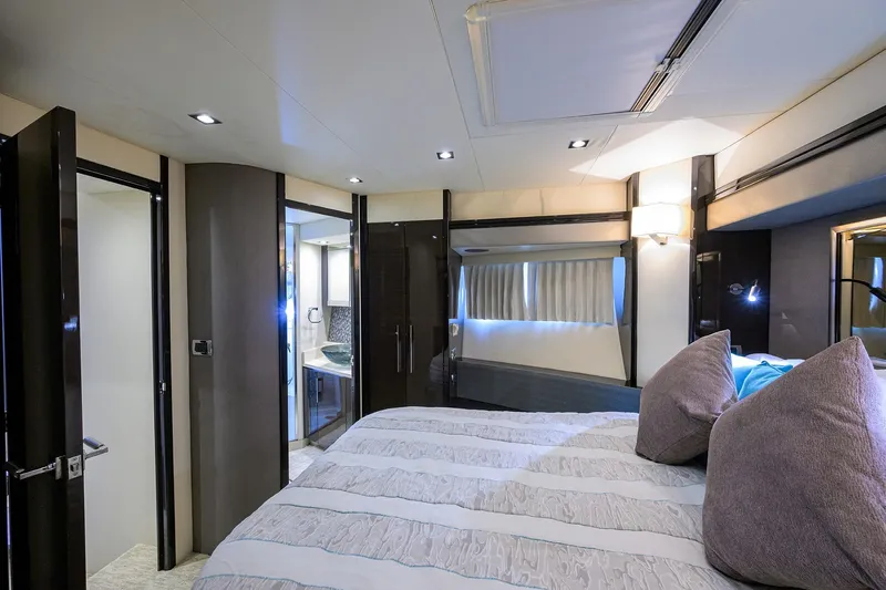 Andiamo Yacht Photos Pics Luxurious interior of 2016 Marquis 660 Sport Yacht bedroom with modern decor.