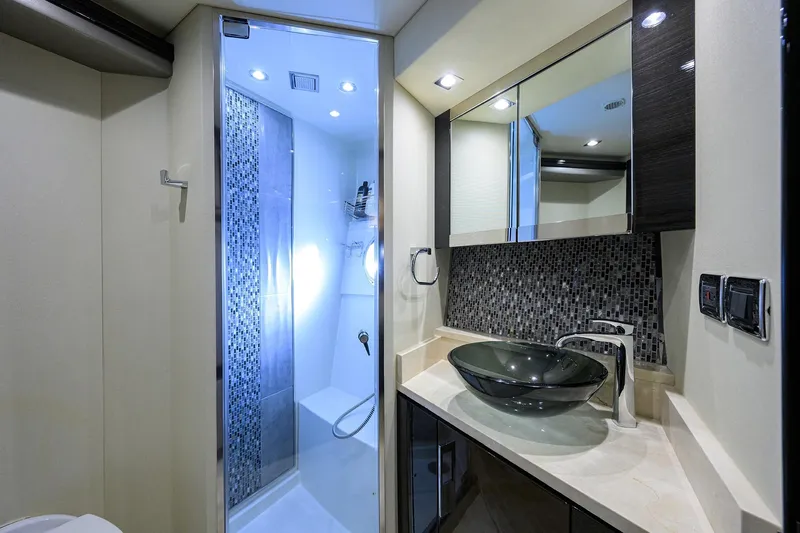 Andiamo Yacht Photos Pics Luxurious bathroom in 2016 Marquis 660 Sport Yacht with modern fixtures and elegant design.