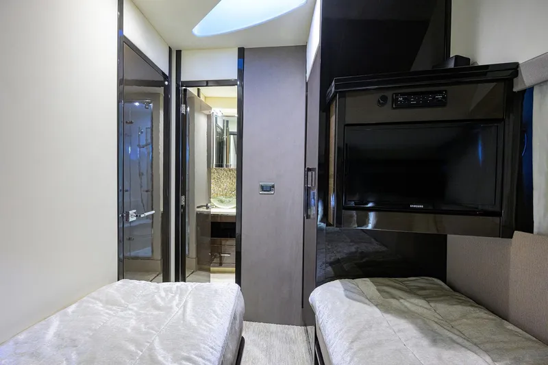 Andiamo Yacht Photos Pics Interior of 2016 Marquis 660 Sport Yacht with twin beds and modern bathroom.