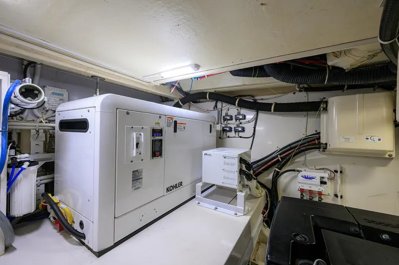 Andiamo Yacht Photos Pics Engine room of 2016 Marquis 660 Sport Yacht with Kohler generator and wiring.