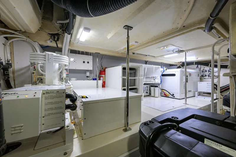 Andiamo Yacht Photos Pics Engine room of 2016 Marquis 660 Sport Yacht, featuring advanced equipment and systems.