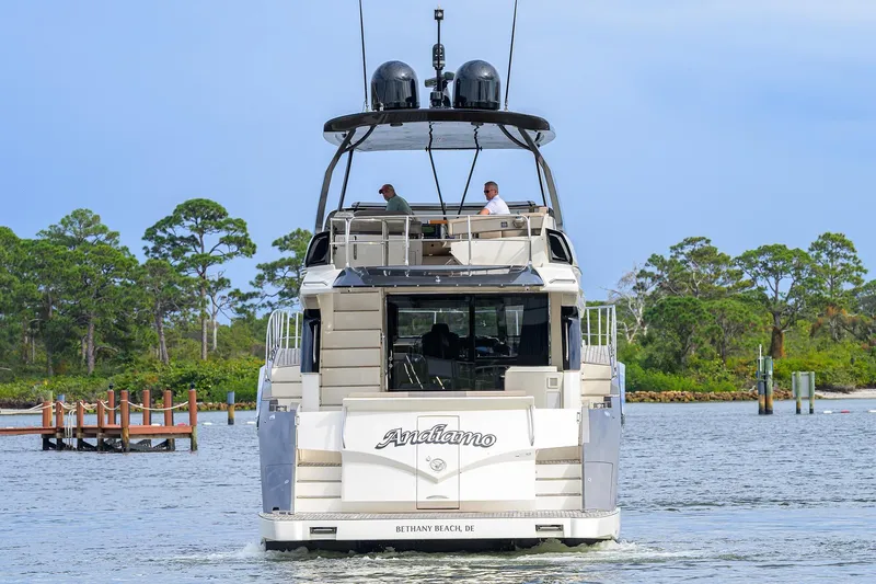 Andiamo Yacht Photos Pics 2016 Marquis 660 Sport Yacht cruising on a scenic waterway.