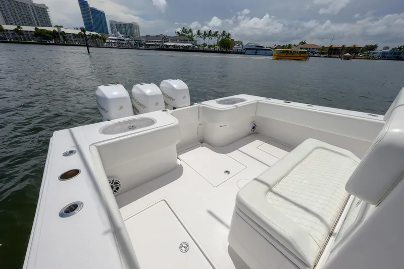 Seahunter 33 Yacht Photos Pics 2018 SeaHunter 33 Tournament boat with triple Mercury engines on a calm waterway.