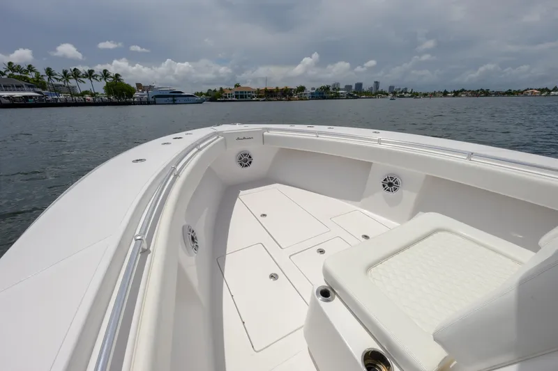 Seahunter 33 Yacht Photos Pics 2018 SeaHunter 33 Tournament boat on calm waters, featuring spacious deck and seating.