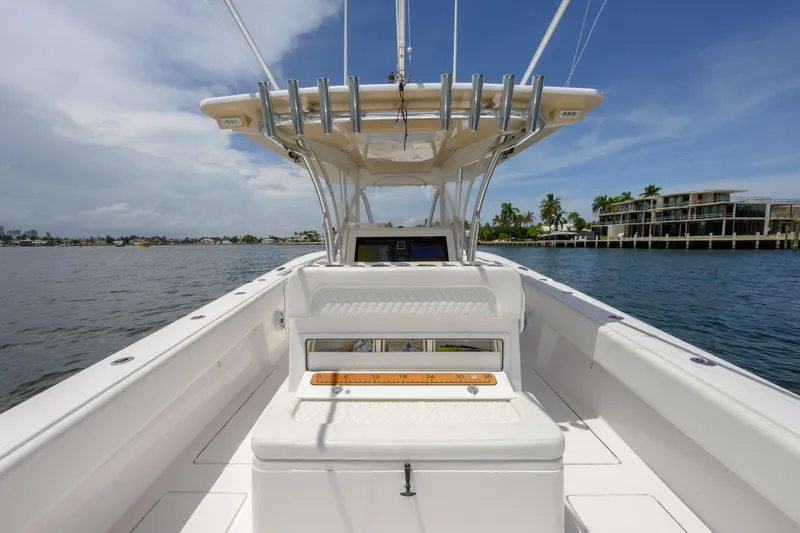 Seahunter 33 Yacht Photos Pics 2018 SeaHunter 33 Tournament boat on calm water, featuring spacious deck and modern design.