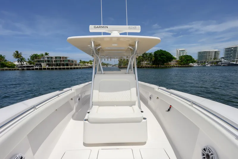 Seahunter 33 Yacht Photos Pics 2018 SeaHunter 33 Tournament boat on calm water, featuring a Garmin navigation system.