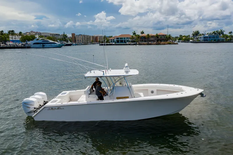Seahunter 33 Yacht Photos Pics 2018 SeaHunter 33 Tournament boat on water, featuring dual Mercury engines.