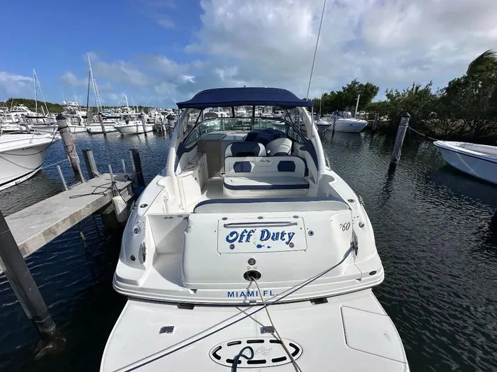 Off Duty Yacht Photos Pics 2004 Sea Ray 360 Sundancer docked in marina, rear view with "Off Duty" nameplate.