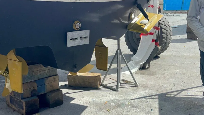 Off Duty Yacht Photos Pics 2004 Sea Ray 360 Sundancer boat hull on blocks, undergoing maintenance.