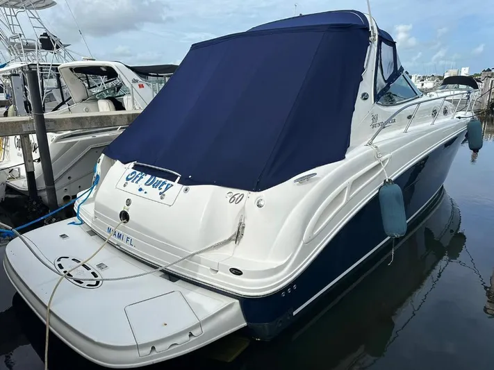 Off Duty Yacht Photos Pics 2004 Sea Ray 360 Sundancer yacht docked in marina, blue cover, Miami, FL.