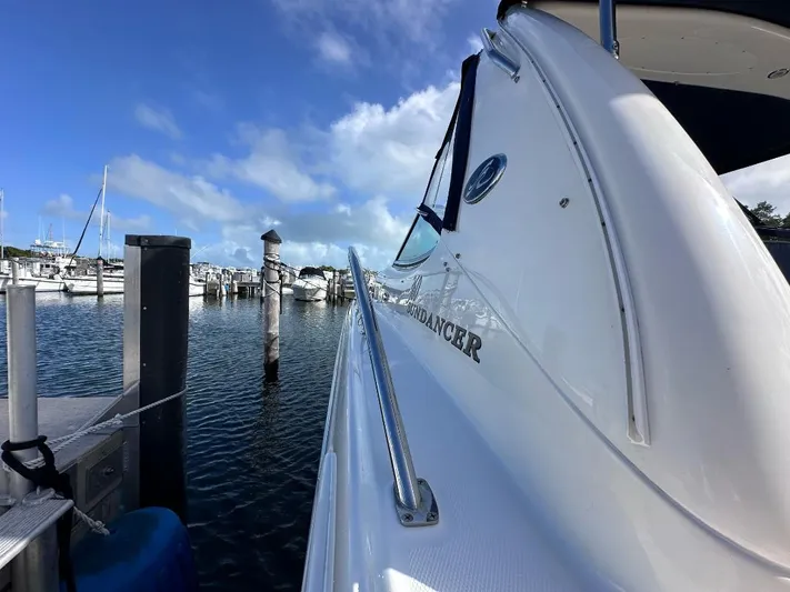 Off Duty Yacht Photos Pics 2004 Sea Ray 360 Sundancer docked at marina under clear blue sky.