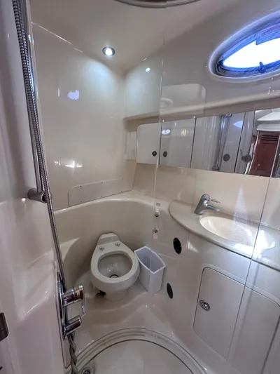 Off Duty Yacht Photos Pics Bathroom interior of 2004 Sea Ray 360 Sundancer yacht, featuring toilet and sink.