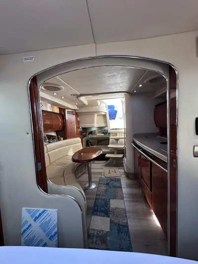 Off Duty Yacht Photos Pics Interior of 2004 Sea Ray 360 Sundancer yacht with elegant seating and kitchenette.