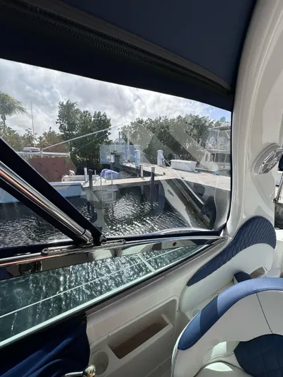 Off Duty Yacht Photos Pics Interior view from a 2004 Sea Ray 360 Sundancer, overlooking a marina.