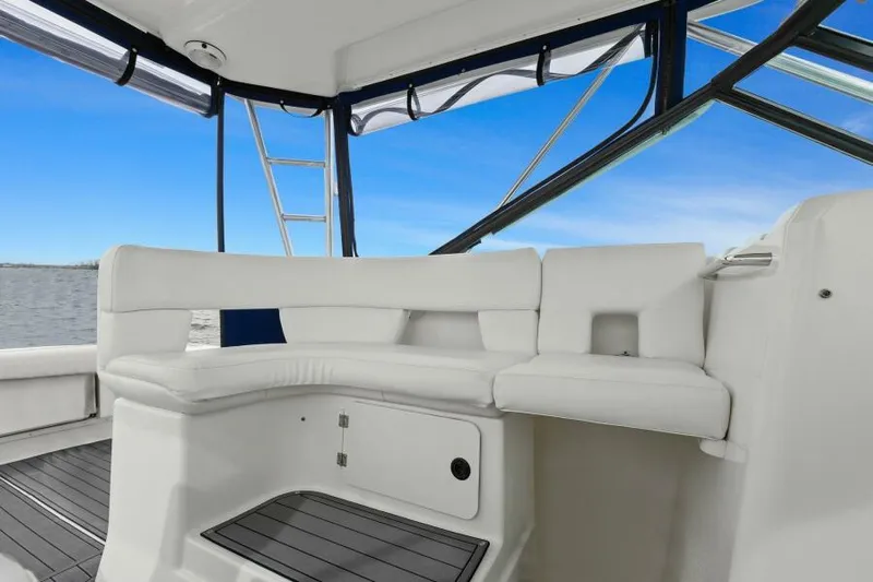 Indeed Yacht Photos Pics 2005 Tiara Yachts 2900 Open interior with white seating and ocean view.
