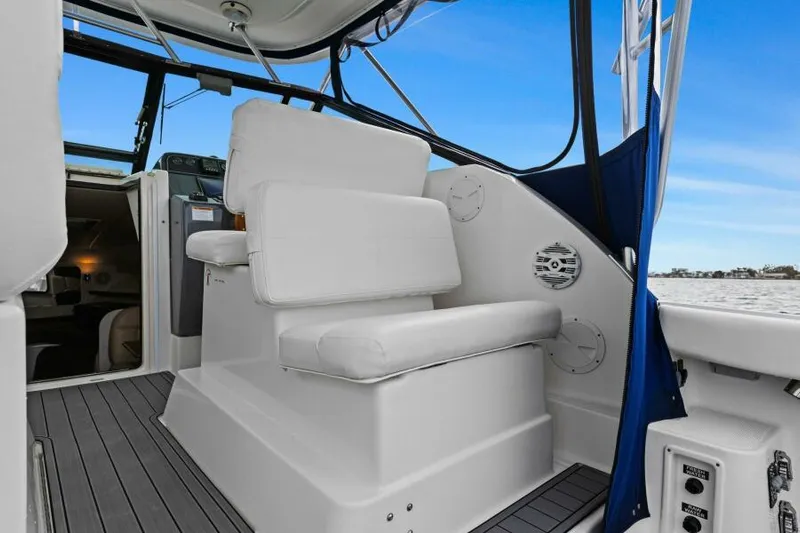 Indeed Yacht Photos Pics 2005 Tiara Yachts 2900 Open interior with white seating and blue accents.