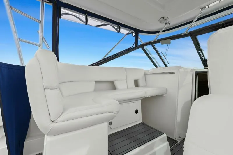Indeed Yacht Photos Pics 2005 Tiara Yachts 2900 Open interior with white seating and blue sky background.