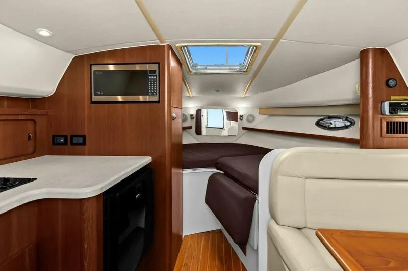 Indeed Yacht Photos Pics Interior of 2005 Tiara Yachts 2900 Open, featuring a cozy cabin with modern amenities.