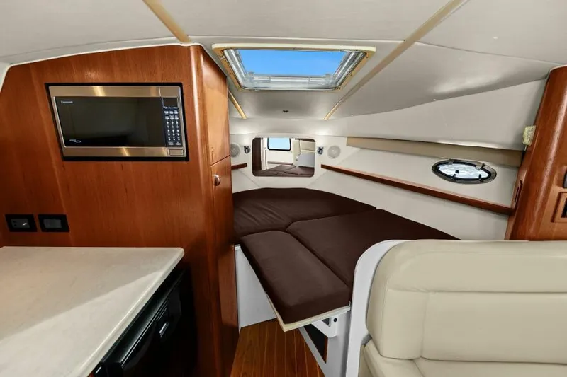 Indeed Yacht Photos Pics Interior of 2005 Tiara Yachts 2900 Open, featuring cozy cabin and modern amenities.