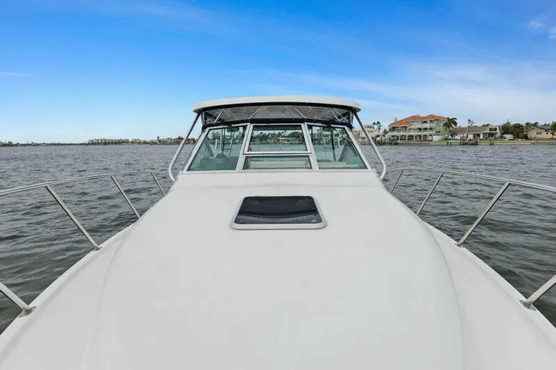 Indeed Yacht Photos Pics 2005 Tiara Yachts 2900 Open on calm waters, showcasing sleek design and spacious deck.