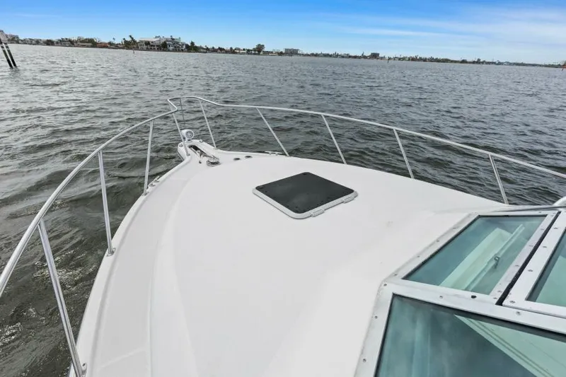 Indeed Yacht Photos Pics 2005 Tiara Yachts 2900 Open on calm waters, showcasing bow and railing.