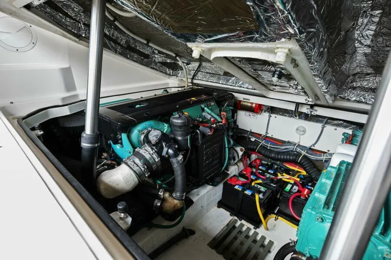 Indeed Yacht Photos Pics Engine compartment of 2005 Tiara Yachts 2900 Open, showcasing mechanical components and wiring.