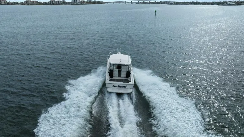 Indeed Yacht Photos Pics 2005 Tiara Yachts 2900 Open cruising on open water, leaving a wake behind.