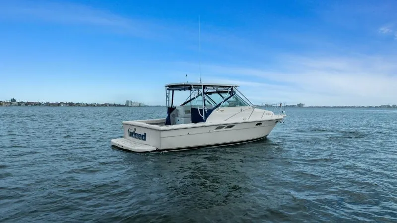 Indeed Yacht Photos Pics 2005 Tiara Yachts 2900 Open boat on calm water under blue sky.
