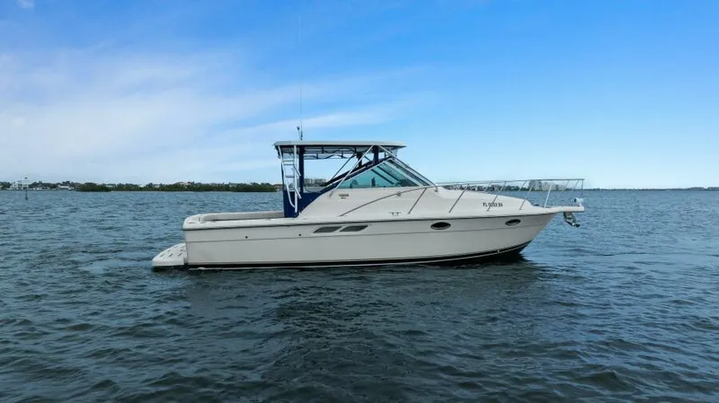 Indeed Yacht Photos Pics 2005 Tiara Yachts 2900 Open cruising on calm waters under a clear blue sky.