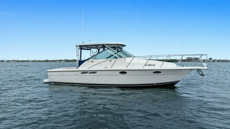 Indeed Yacht Photos Pics 2005 Tiara Yachts 2900 Open cruising on calm waters under a clear blue sky.