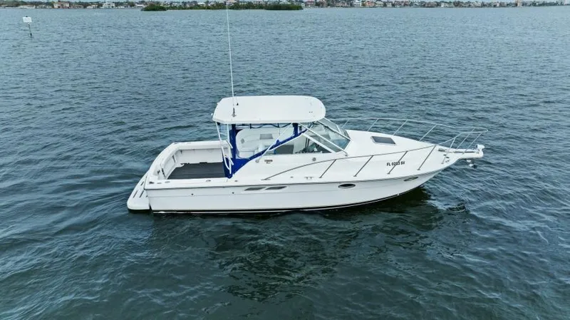 Indeed Yacht Photos Pics 2005 Tiara Yachts 2900 Open boat on calm water.