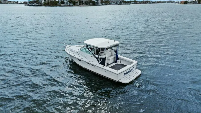 Indeed Yacht Photos Pics 2005 Tiara Yachts 2900 Open boat on calm water.