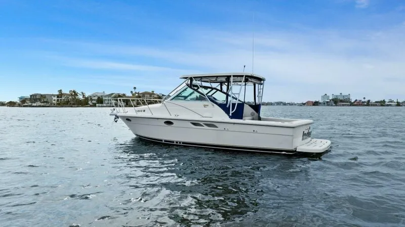 Indeed Yacht Photos Pics 2005 Tiara Yachts 2900 Open on calm water, clear sky background.