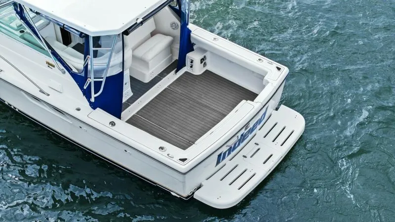 Indeed Yacht Photos Pics 2005 Tiara Yachts 2900 Open boat on water, rear view.